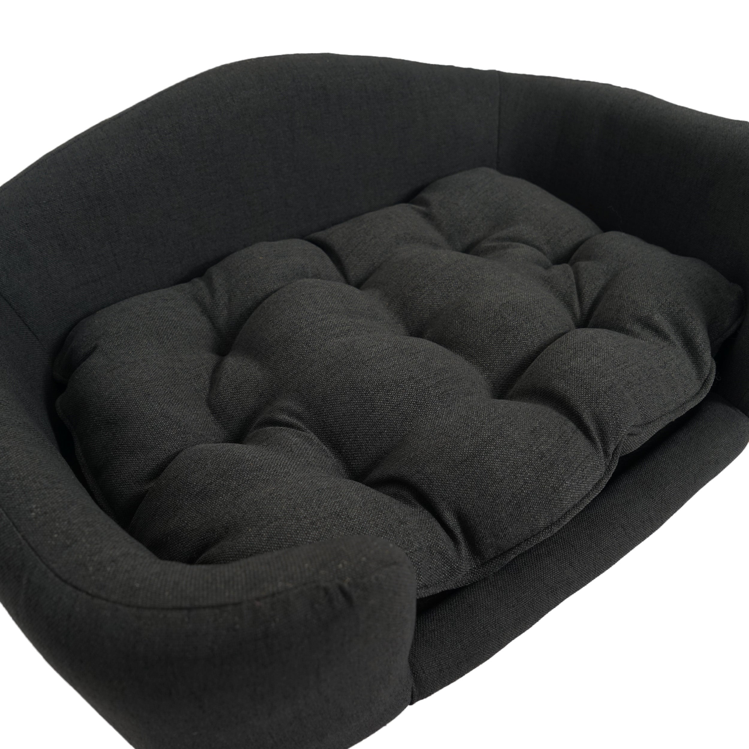Black pet bed with tufted cushion on a white background