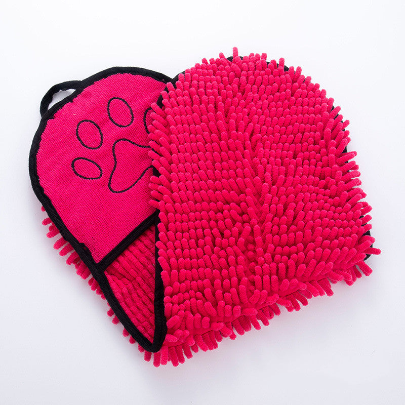 Heart-shaped pink grooming mitt with a paw print on a white background