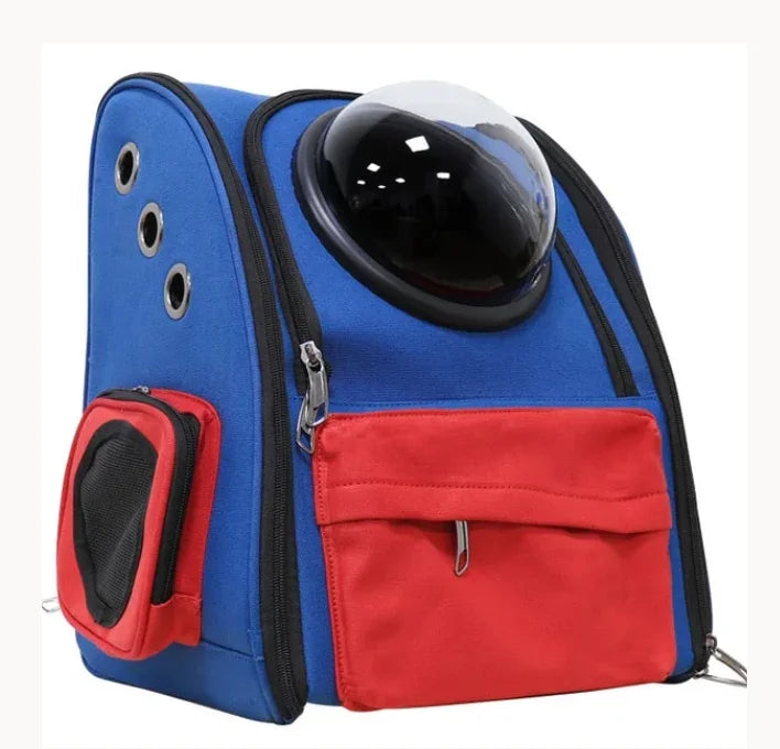 Blue and red pet carrier backpack with bubble window and ventilation holes for travel.