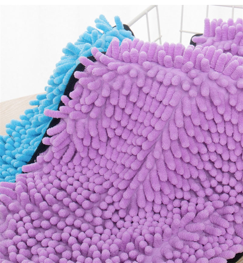 Close-up of purple and blue textured cleaning pads on a white background