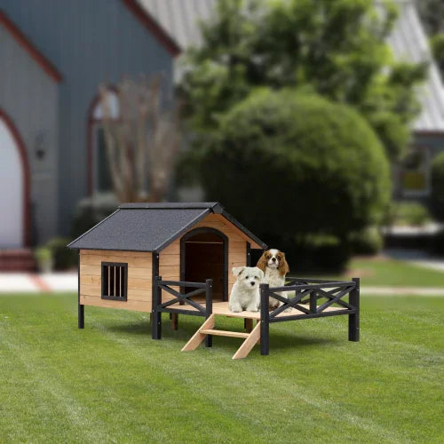 Two dogs on a wooden outdoor dog house with fenced porch and ramp on grassy lawn