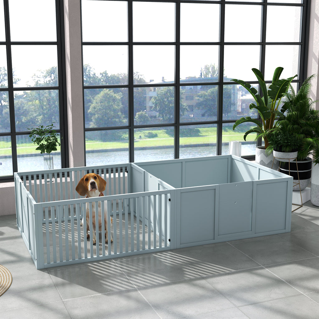 Dog inside a large light blue pet pen with a view of a lake and trees through the window.