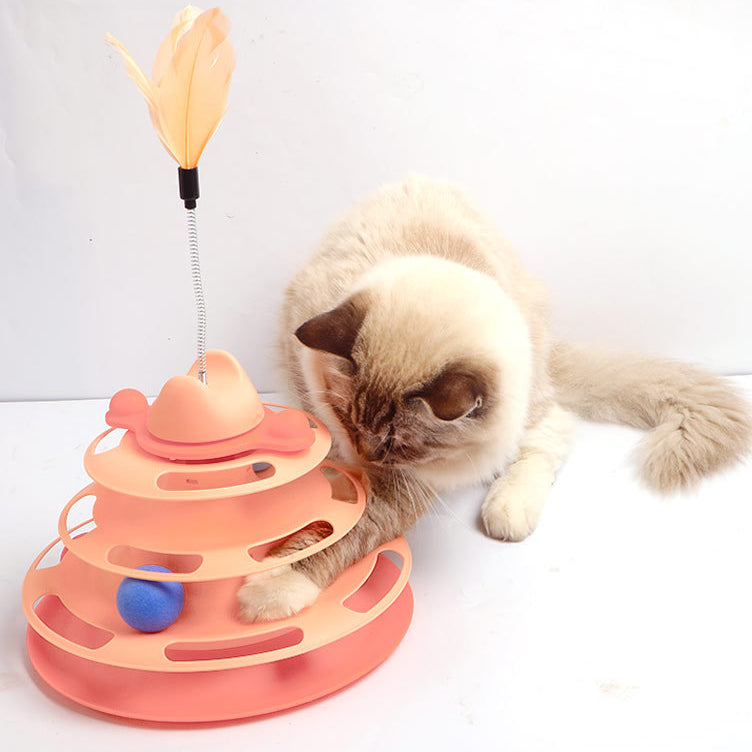 cat playing with colorful tower