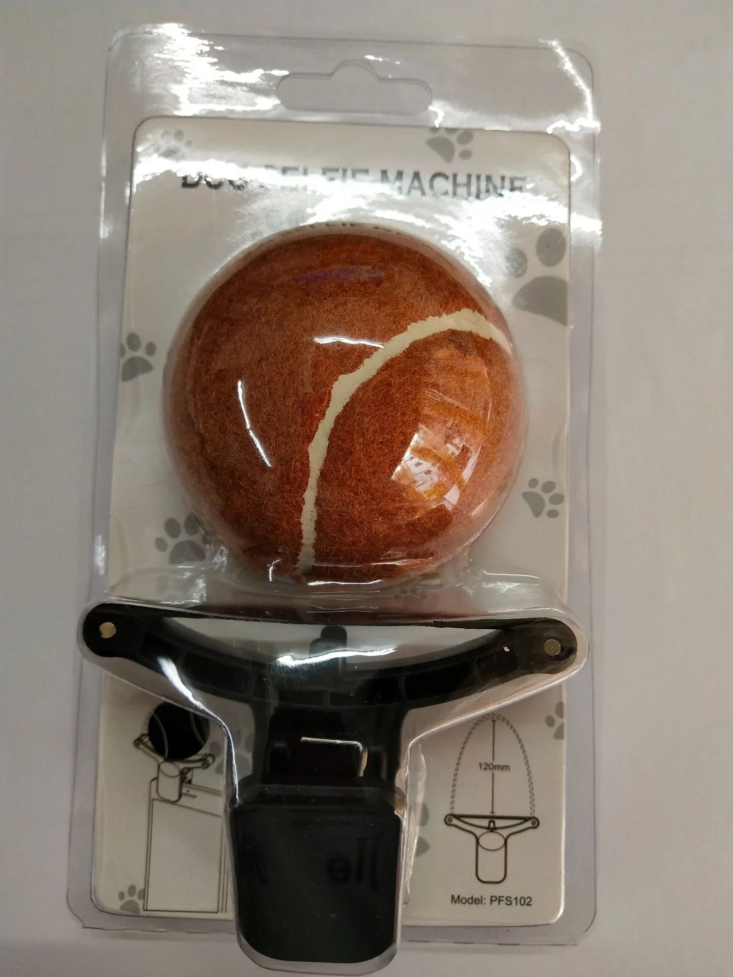 Dog selfie ball attachment for phone, pet photo accessory in retail packaging