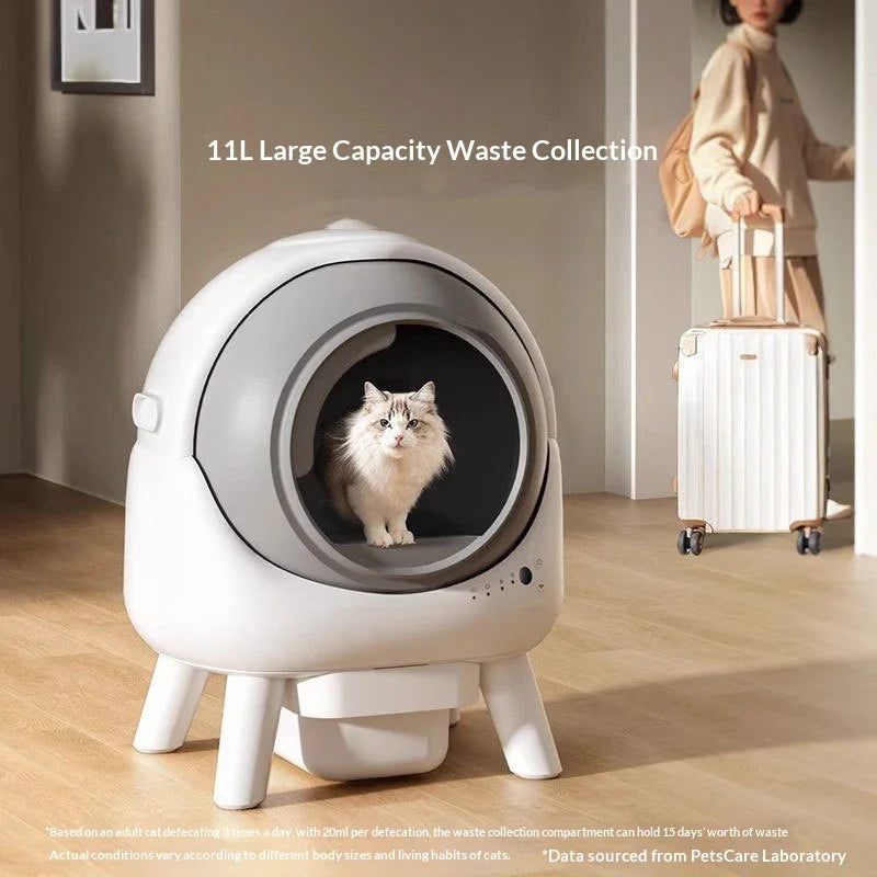 White fluffy cat sitting inside automatic self-cleaning cat litter box with large capacity waste collection, in a modern home interior.