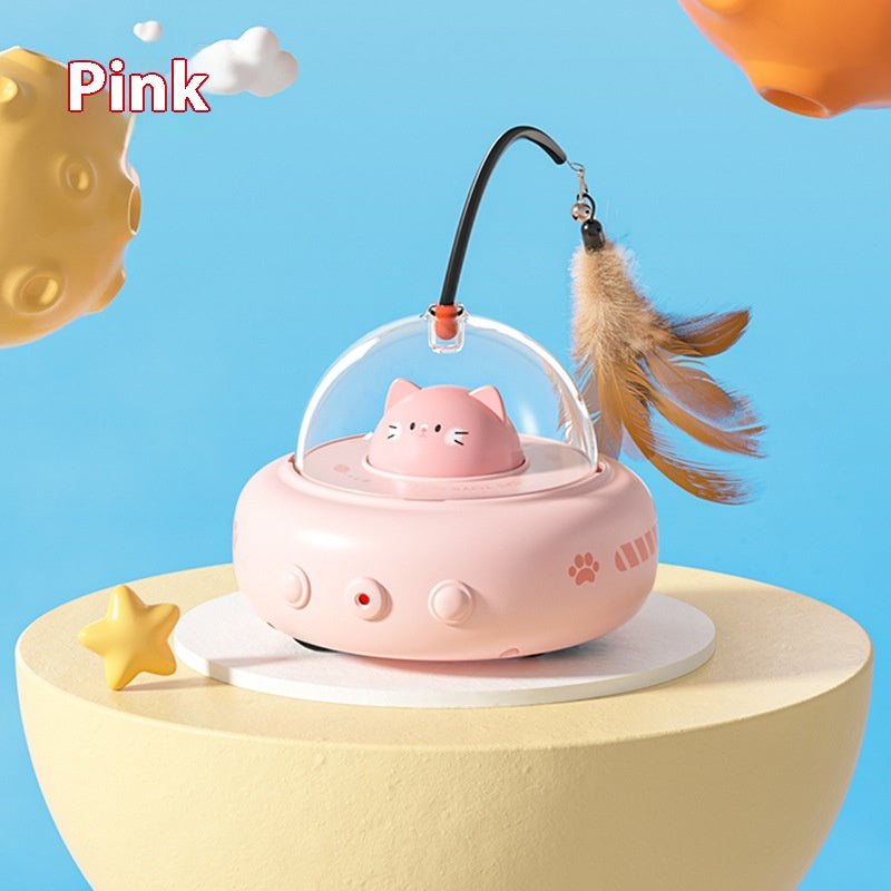 Pink cat-shaped toy with a transparent dome and feather on a blue background