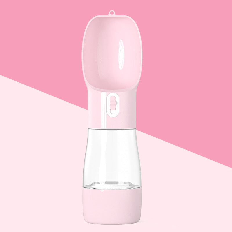 Clear water bottle with pink base and cap on a pink background